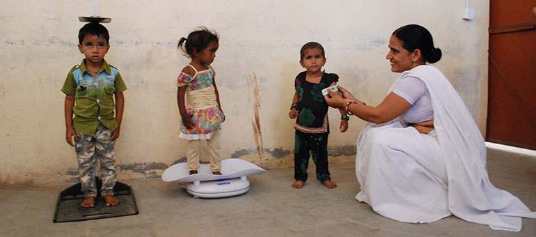 Kids being measured to assess progress in India