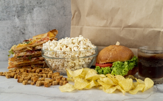 Photo of popcorn, burger and potato crisps Photo of popcorn, burger and potato crisps