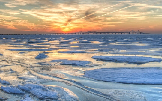Frozen bay at sunrise