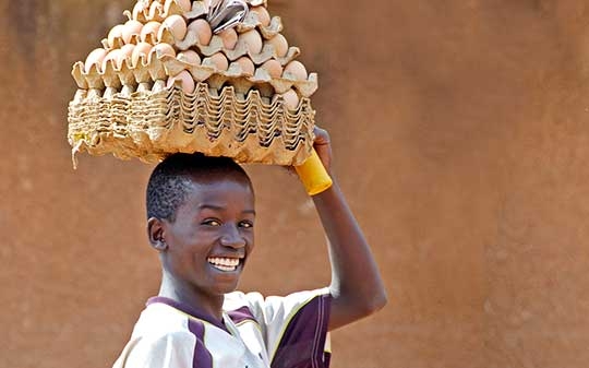 Adolescent carrying eggs in Africa