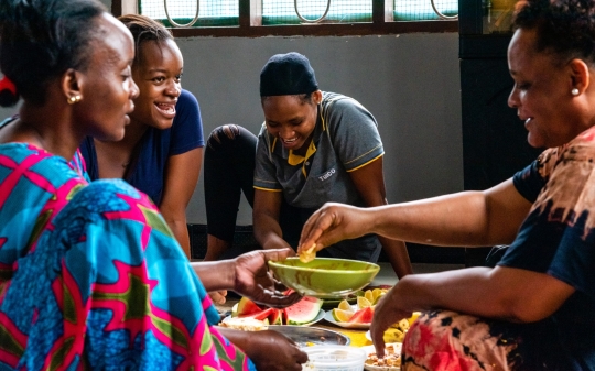 Four ladies serving food