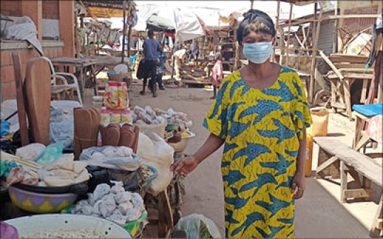 Woman Vendor wearing a Mask at Birnin Market, Kebbi, Nigeria