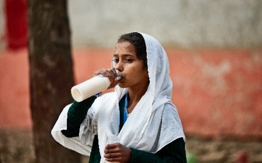 Young girl drinking milk Young girl drinking milk