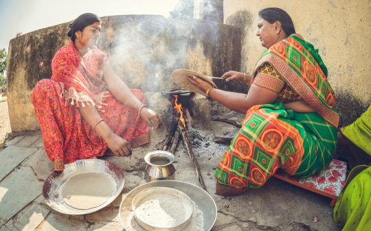 Two women cooking